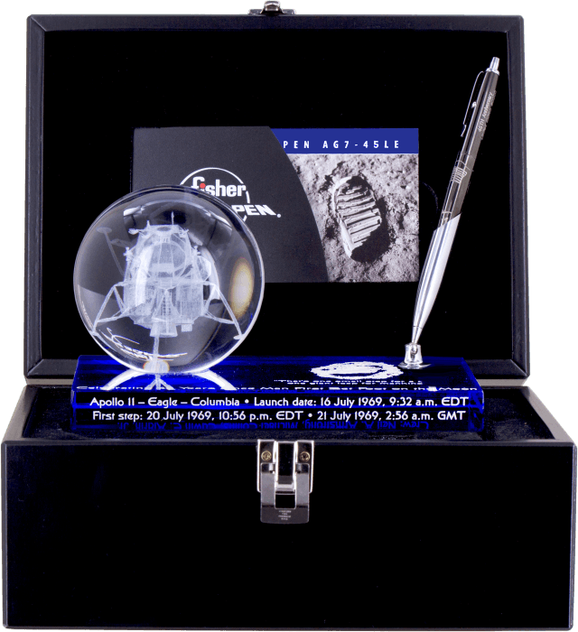 Black wood box with AG7-45LE Apollo 11 45th Anniversary Astronaut Space Pen, Limited Edition space pen in Dark Matter black titanium nitride with chrome accents inside. The pen is in the pen holder of the commemorative paperweight featuring the mission's