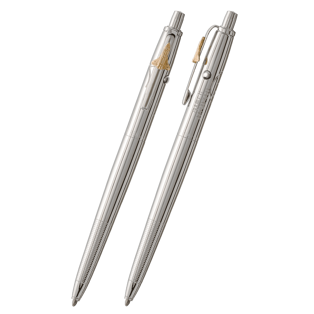 Front and side views of the AG7E Original Astronaut Space Pen in chrome. The clip has a gold space shuttle emblem attached. The button to extract the refill is on the end of the pen, the retract button is on the side of the pen near the clip. On the side